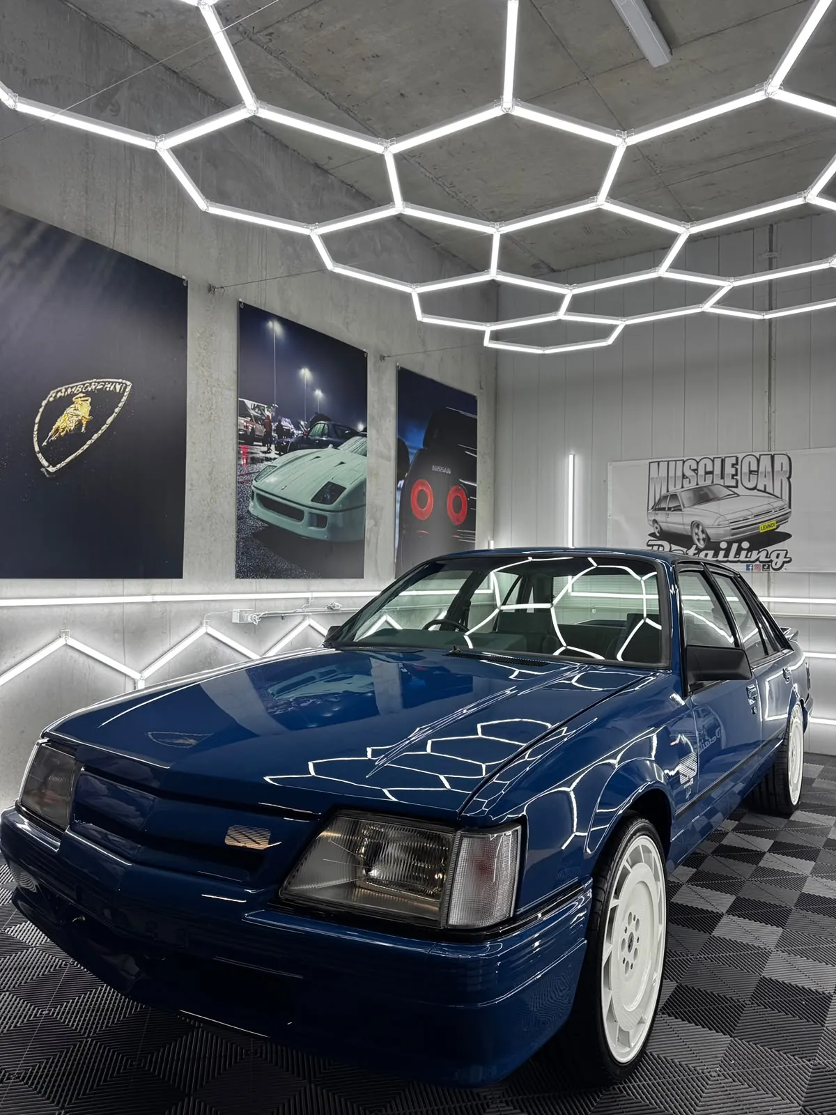 Blue Holden VL Commodore under the hexagon lights in the Oran Park studio